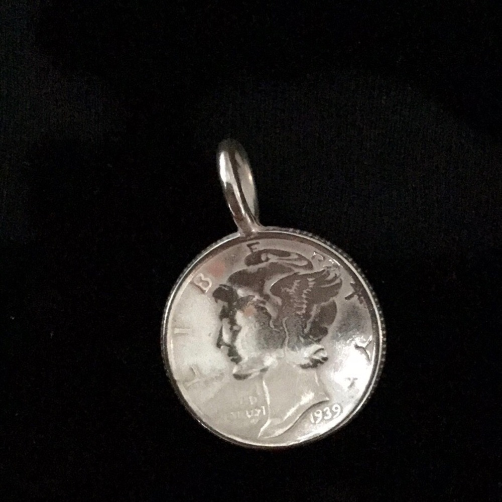 Sterling silver dime pendant.